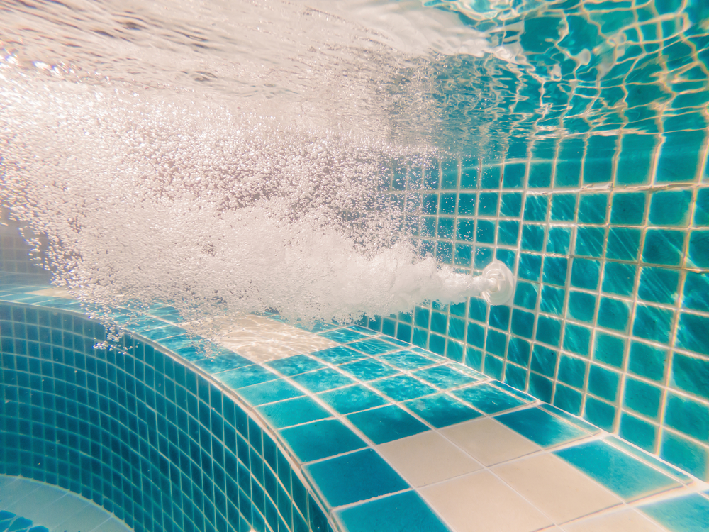 under water pool working drain close up.