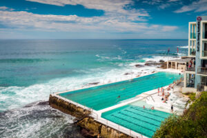 Sydney, Australia - November 6, 2015: People at the Bondi Beach open swimming pool during a day. Bondi beach is one of the most famous tourist sites in Australia