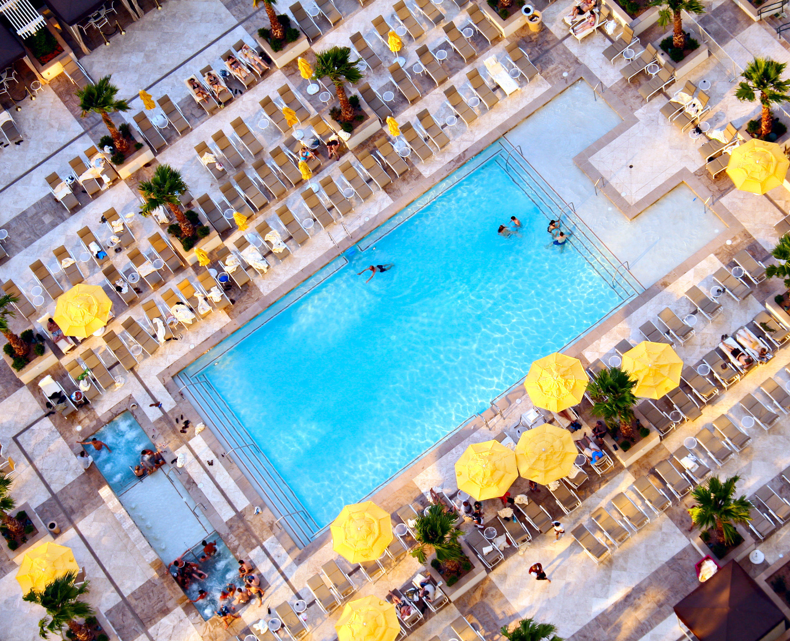 An aerial view of a pool, captured from above, providing a unique perspective of the pool and its surroundings
