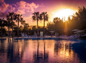 Large swimming pool in a resort in Fuerteventura at sunset, Canary Islands, Spain