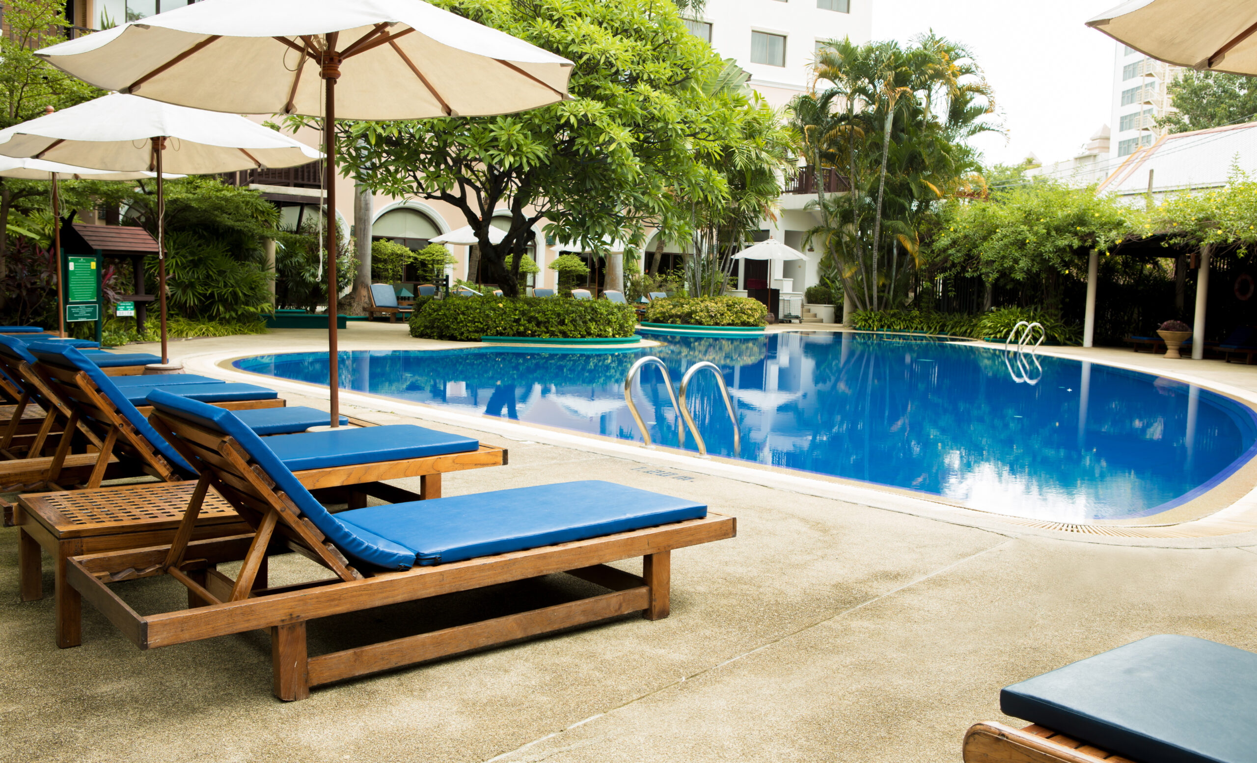 In-pool seating, such as underwater benches or submerged lounge chairs, designed to provide comfortable relaxation and socializing within the pool while partially submerged in the water.