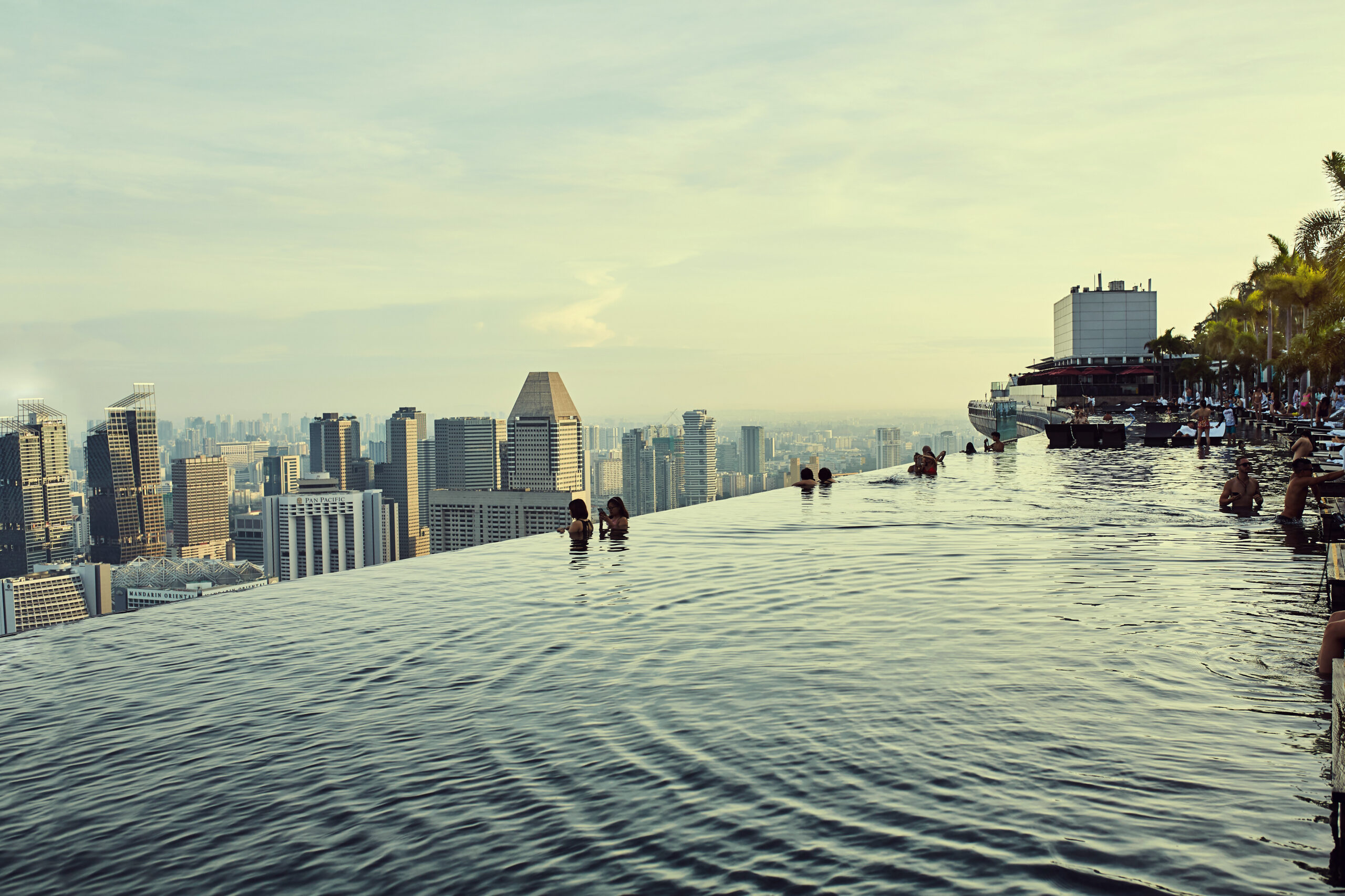 A rooftop pool surrounded by city buildings