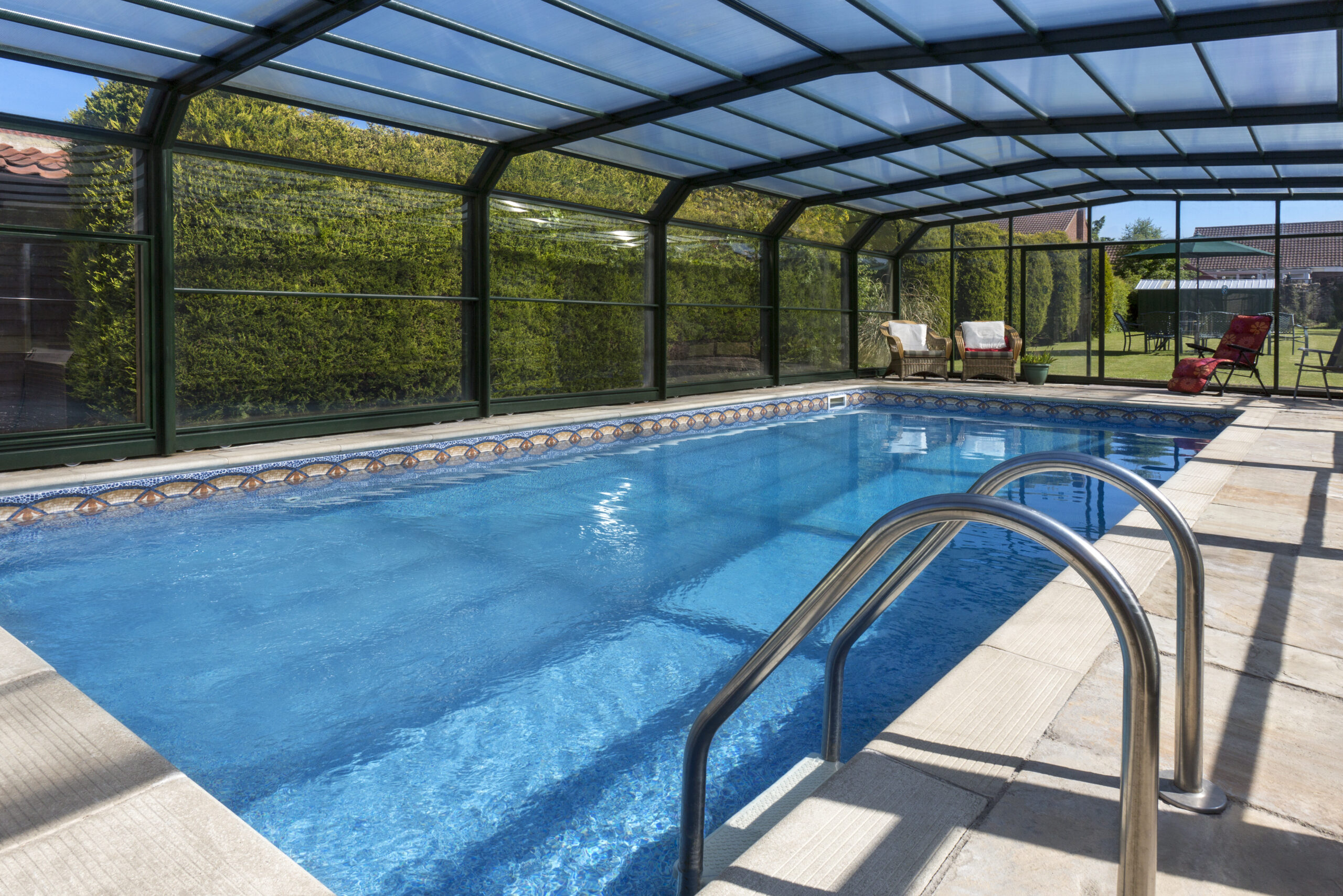 A soundproof pool enclosure, designed to minimize noise transmission in and out of the pool area, providing a quiet and serene environment for relaxation and enjoyment.
