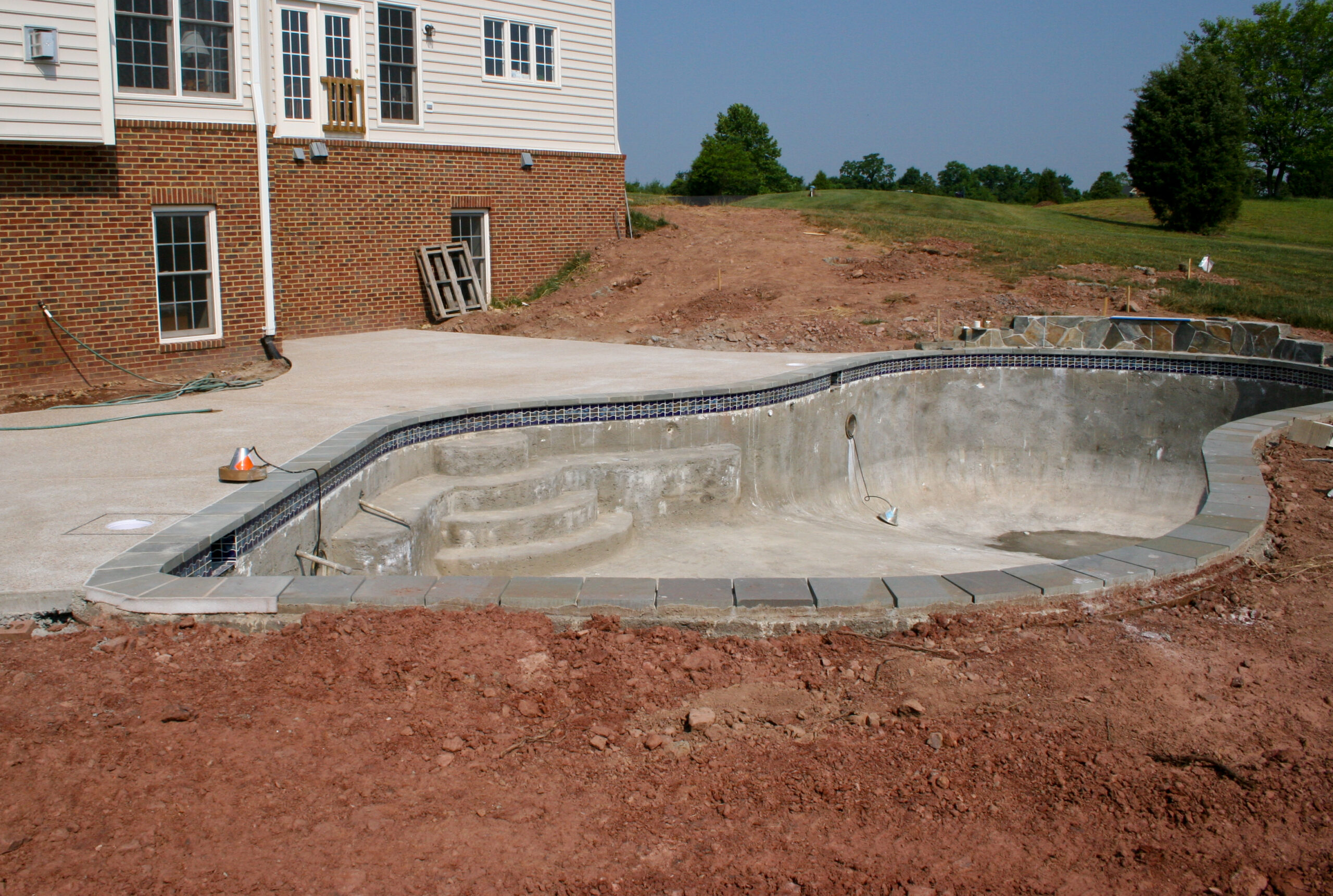 An unfinished pool interior in the process of being designed and constructed.