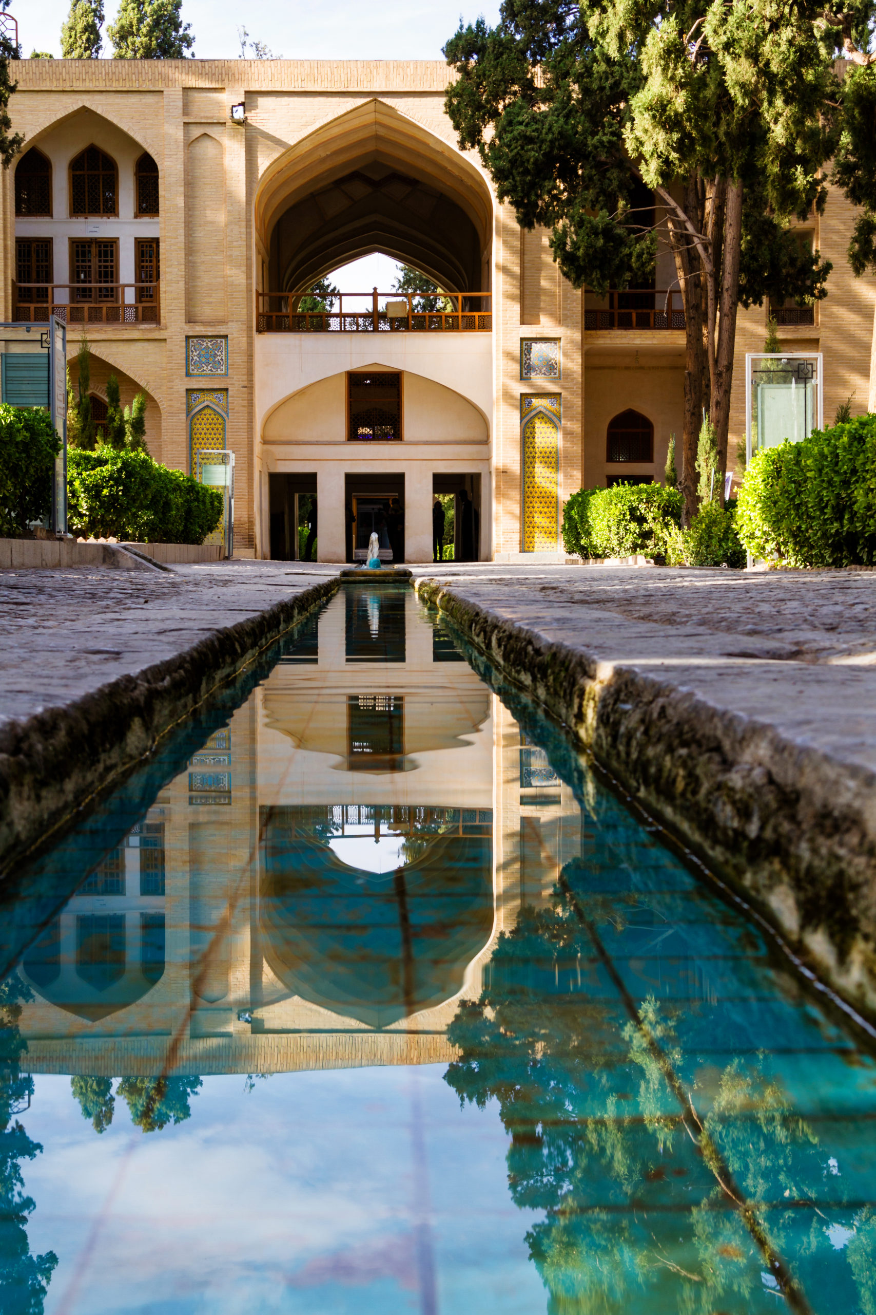 A tranquil reflecting pool mirroring the surrounding architecture and sky