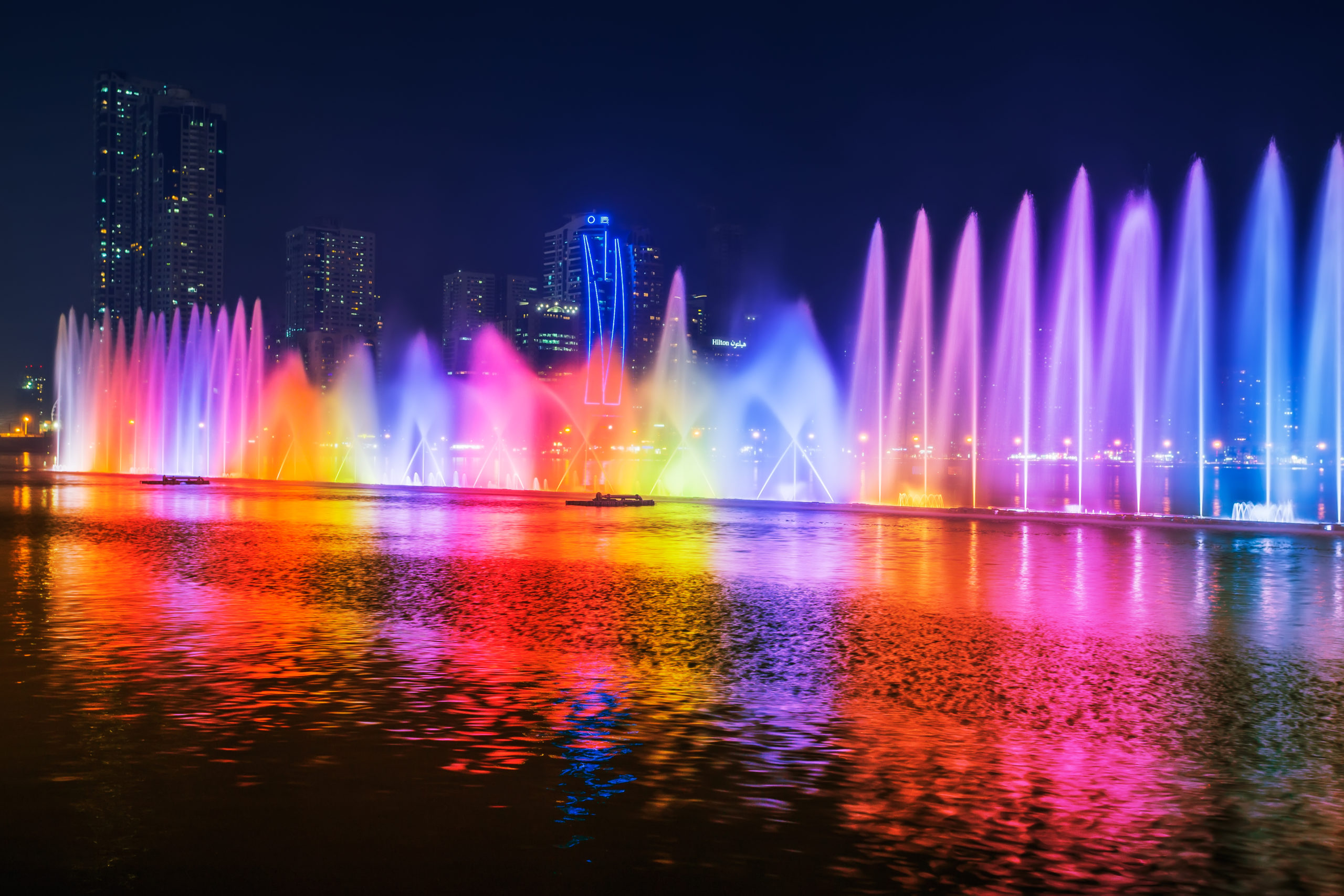 Colorful lights adorning the pool area, creating a vibrant and dynamic atmosphere.