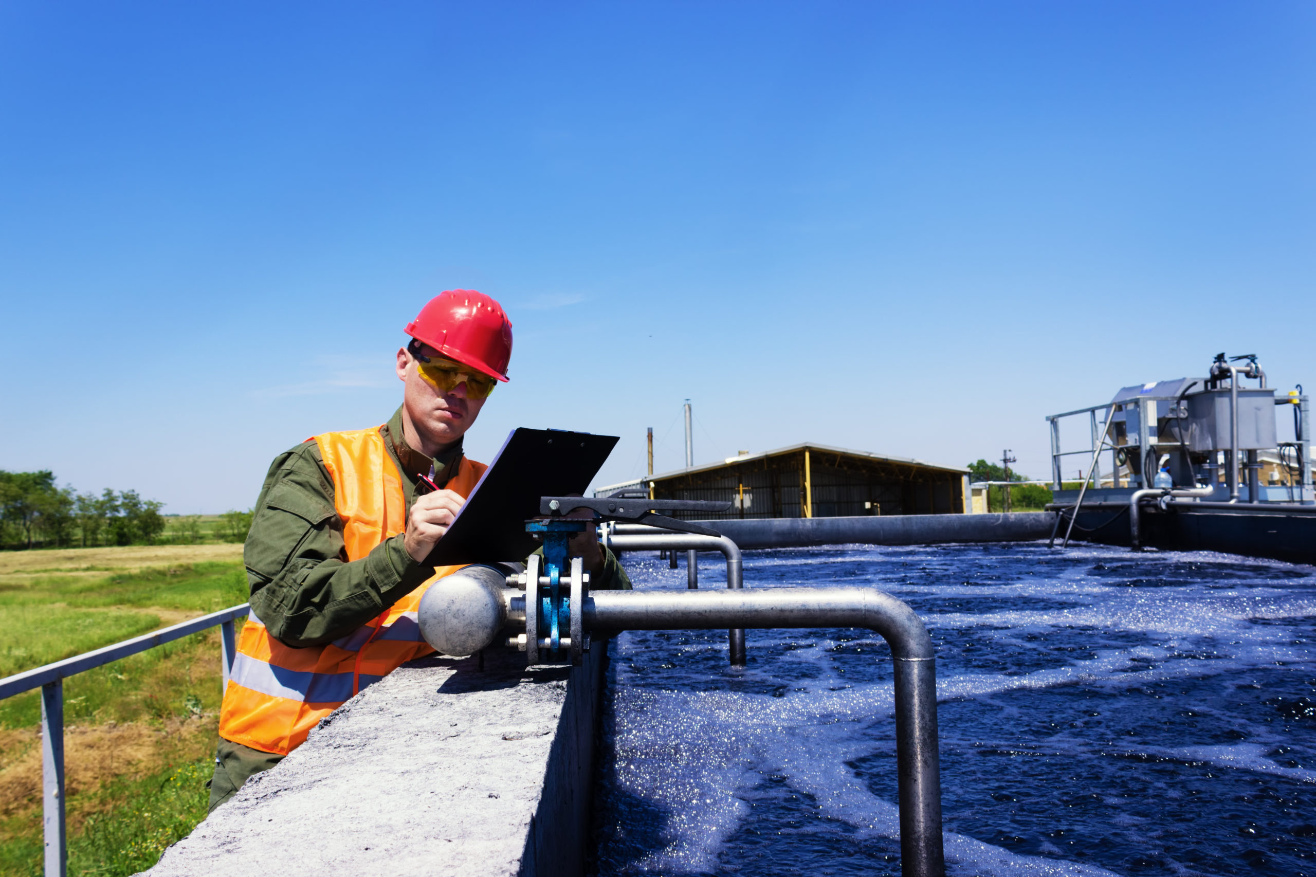 A man conducting a pool inspection, carefully examining the pool's condition, equipment, and safety features to ensure its proper maintenance and compliance with regulations.