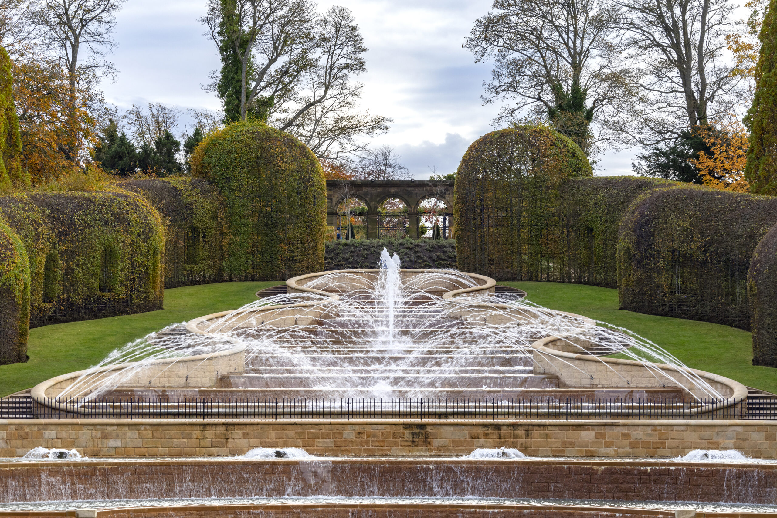 Pool fountains, decorative water features in a pool that create aesthetically pleasing visual displays and soothing water sounds.