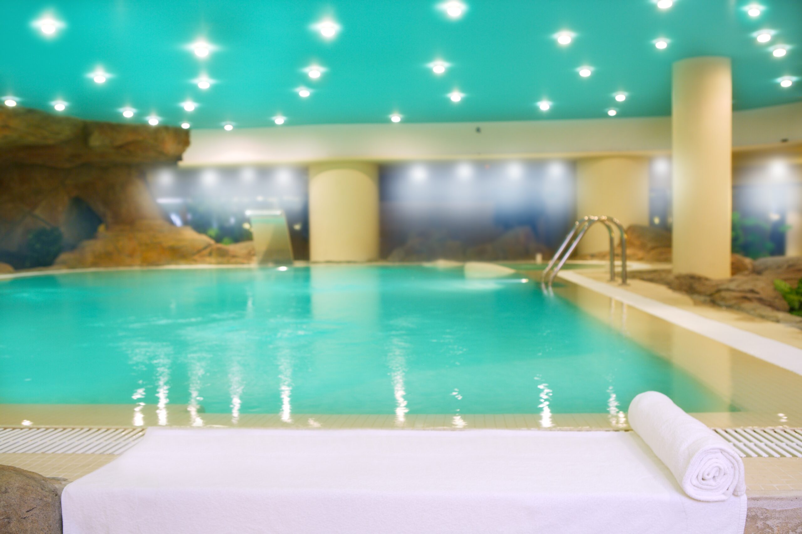 Color-changing lights at a pool, demonstrating dynamic and vibrant illumination that can transform the pool's ambiance with a variety of hues and patterns.