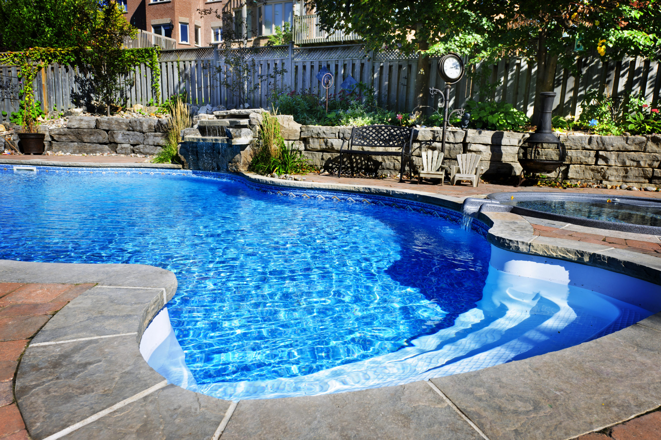 A sparkling pool shimmering in the sunlight, with rays of sunshine dancing on the water's surface, creating a dazzling and inviting scene.