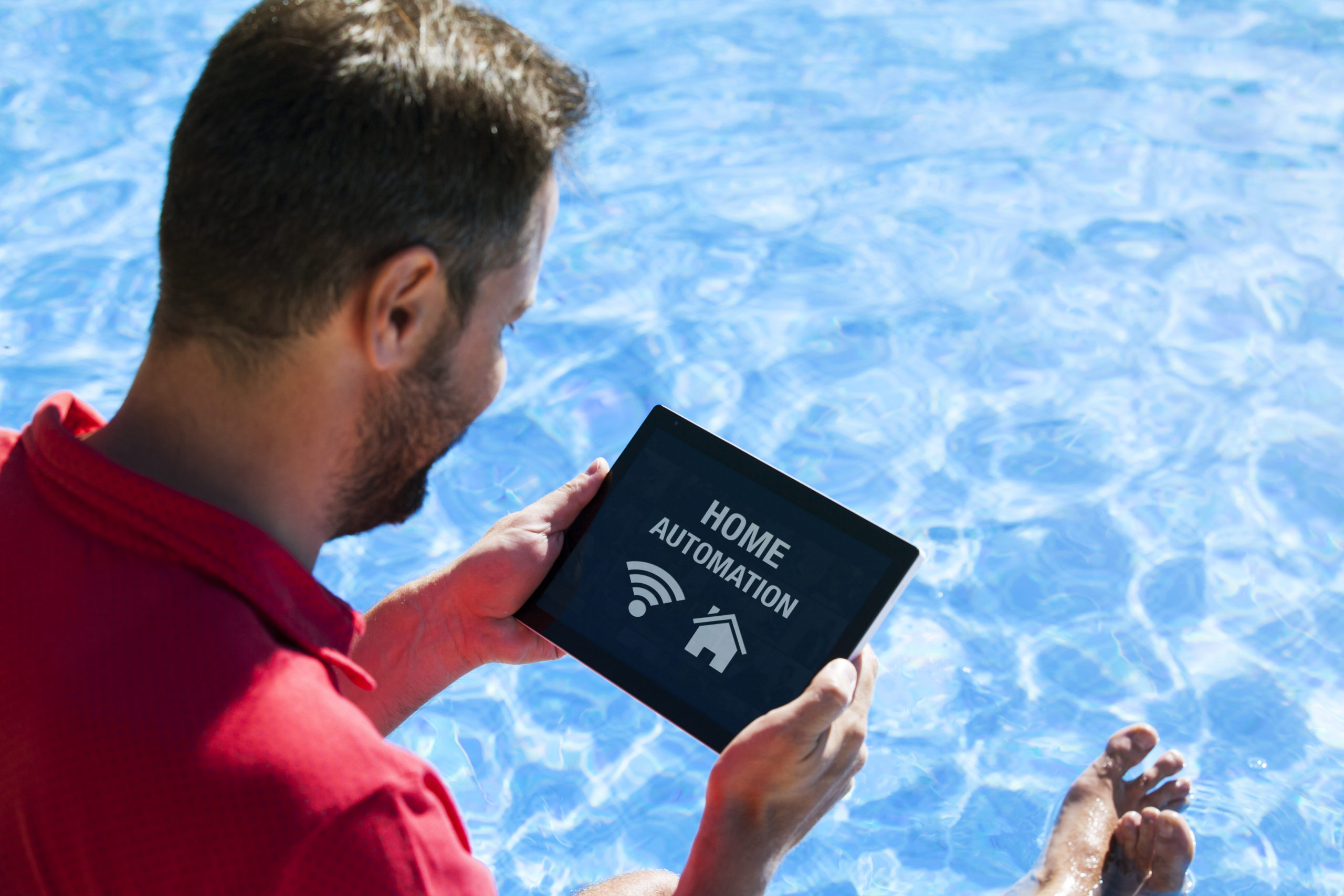 A smart device, such as a smartphone or tablet, being used to control and automate various functions of a swimming pool, including temperature, filtration, and lighting, for convenient and efficient management.